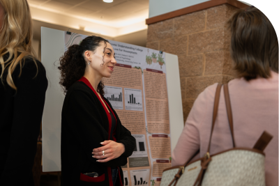student presenting to her peers at a student showcase
